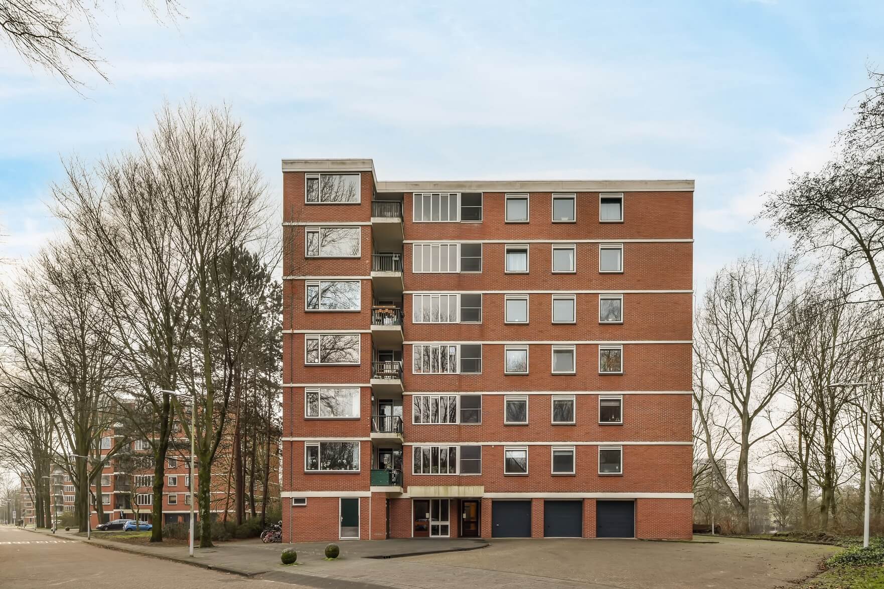 How to Make Money in Real Estate Passively a multi storey brick building 2022 04 05 04 19 33 utc.jpg